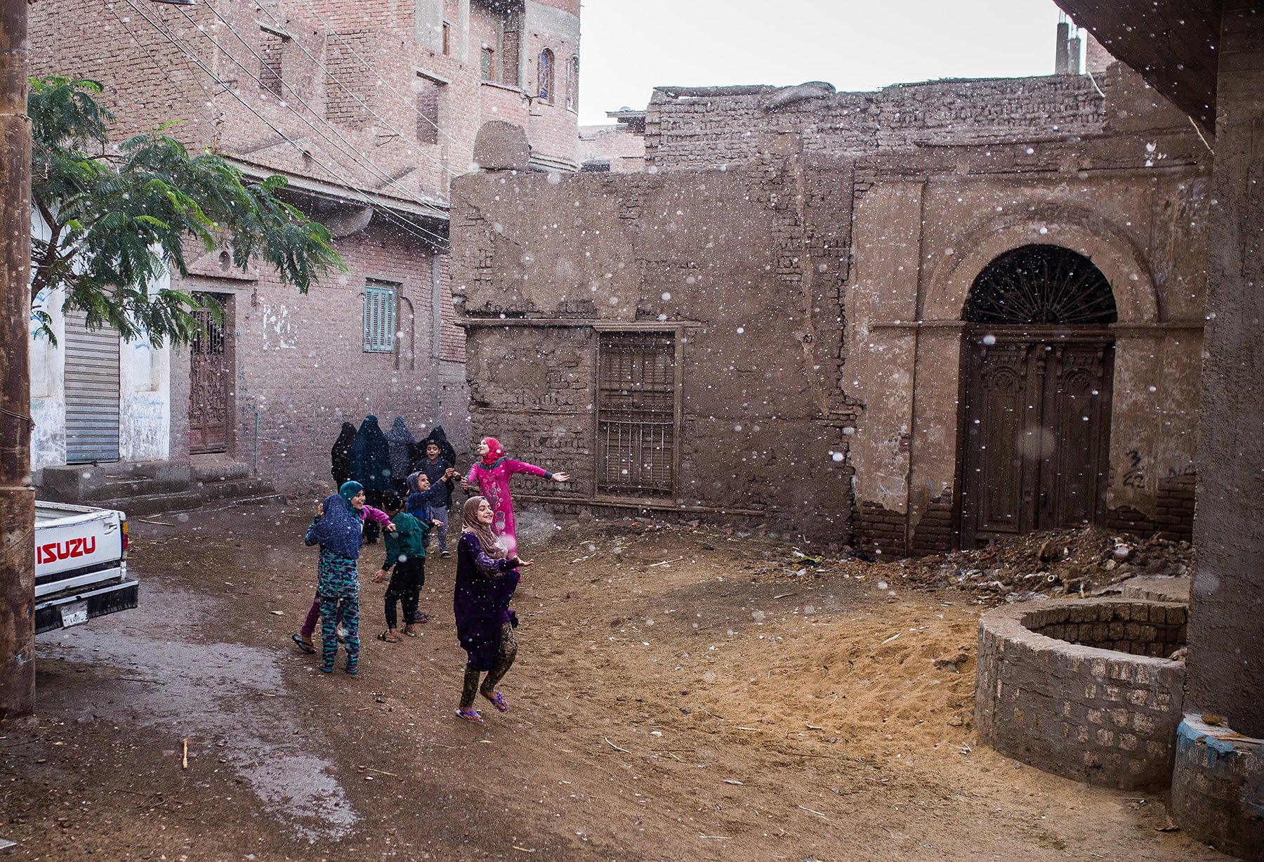 I took this photo during a rainy day in November 2018 from the window of my family home in Fayoum, Egypt, located about 100 kilometers southwest of the capital. It hardly rains but a few times in the year in most parts of Egypt, and when it does, it is always something special, bringing joy and happiness particularly for the local children. —Hesham Elsherif