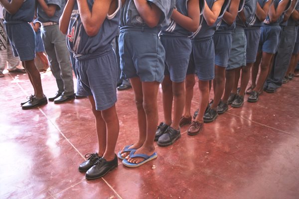 Children line up for lunch in the Edhi Village.