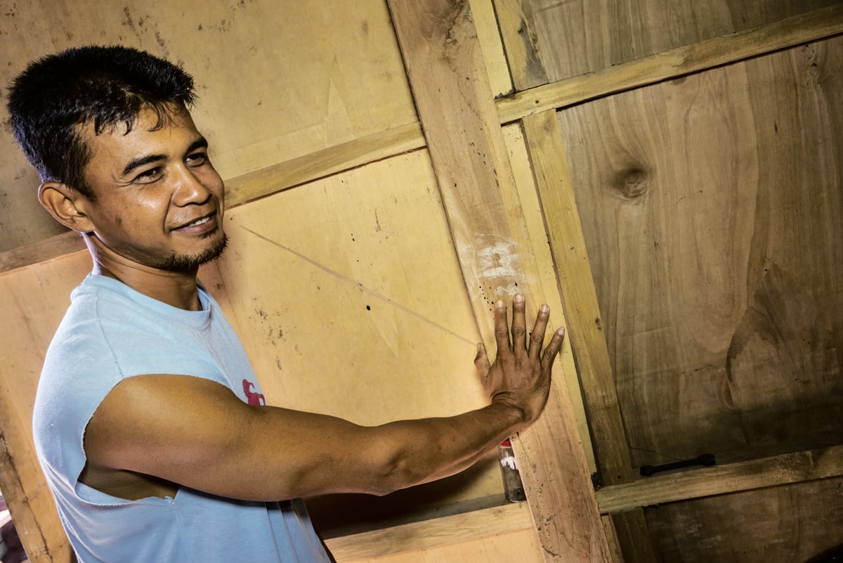 <p>In what may be a contemporary echo of a practice that began 40,000 years ago, Syarifuddin, a resident in a village near the park, shows the faded ceremonial handprints that he placed four years ago on the timbers of his home to bring&mdash;as tradition has it&mdash;good fortune.&nbsp;</p>
