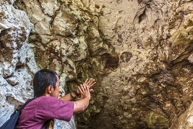 Mimicking the artists&rsquo; method, Pampang lays a hand on a wall in another cave: Of all the motifs in these caves, the hand stencils are the most common. The practice, asserts world cave-art specialist David Lewis-Williams, was not so much &ldquo;to make a picture of a hand (&lsquo;I was here&rsquo;), but rather to make contact with the spiritual realm and its power.&rdquo;&nbsp;