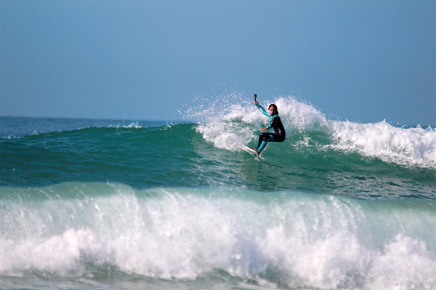 <p>Riding the beach break at &ldquo;K17,&rdquo; which locals call the surf location 17 kilometers north of Agadir, El Gardoum films herself with a GoPro camera. El Gardoum wanted to learn to surf as a young girl and today she is one of the many young Moroccans putting North African surfing on the map.</p>
