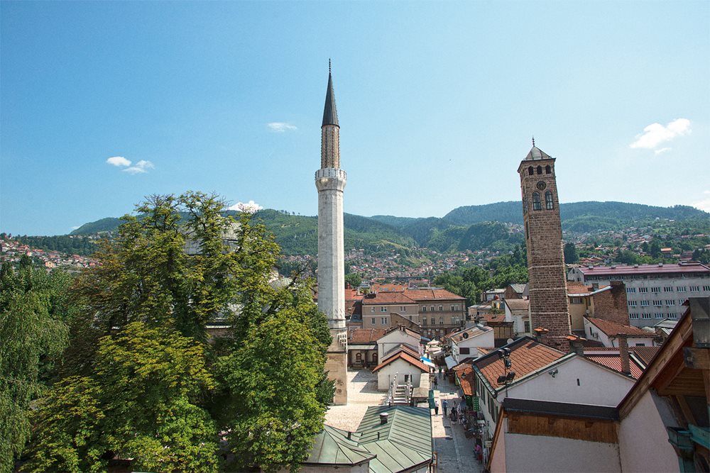 <p>To the east of the new Gazi Husrev-beg Library, which opened in 2014, lies the library’s first home, in the 16th-century mosque-and-madrasa complex built by Husrev-beg. The hills surrounding the city, which held snipers during the Siege of Sarajevo, are today a postcard backdrop to Sarajevo’s old city.</p>
