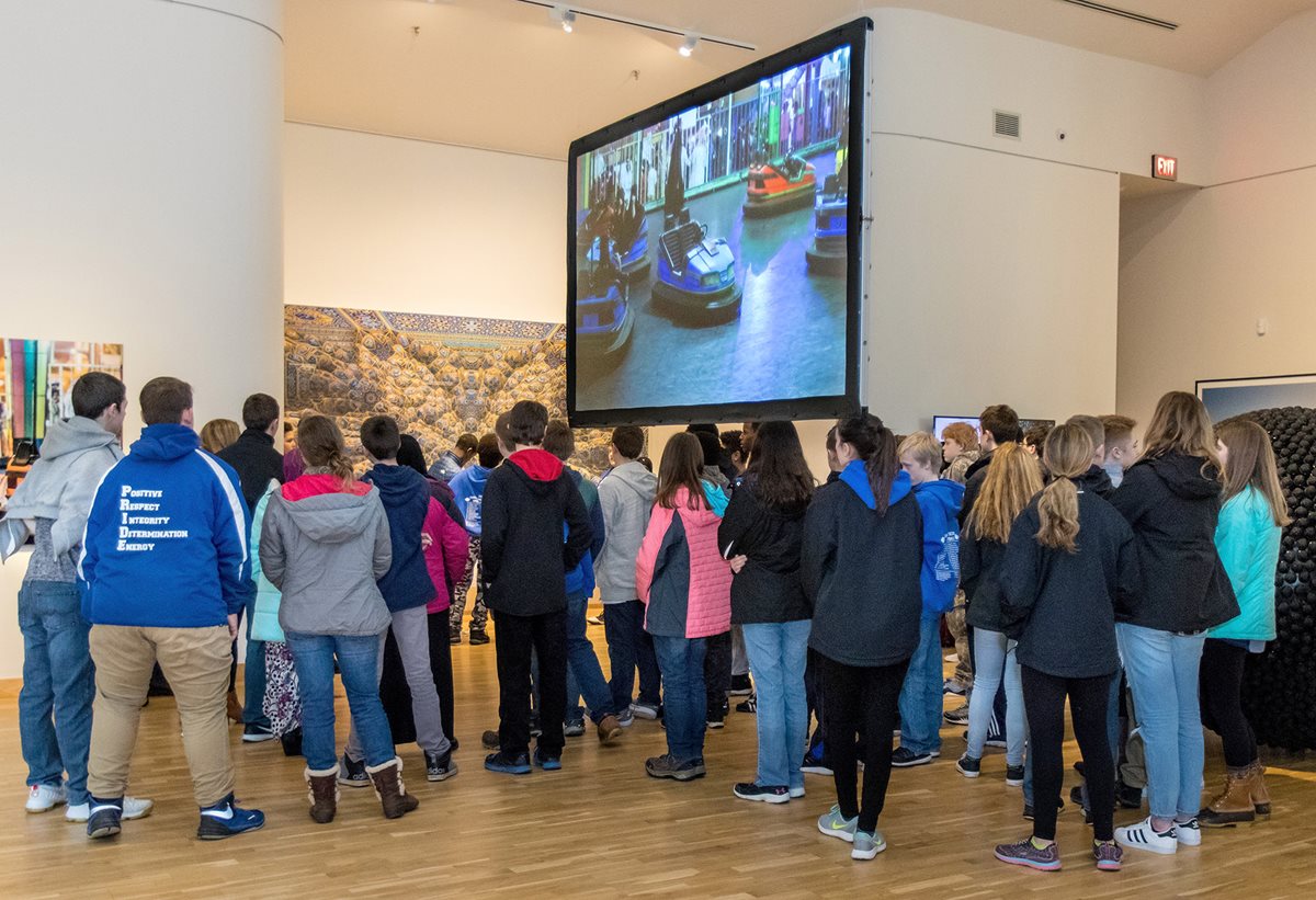 <p align="LEFT" dir="LTR"><span lang="EN">Students watch Arwa Al-Neami&rsquo;s &quot;Never Never Land&quot; video during the &quot;Phantom Punch&quot; exhibit.</span></p>
