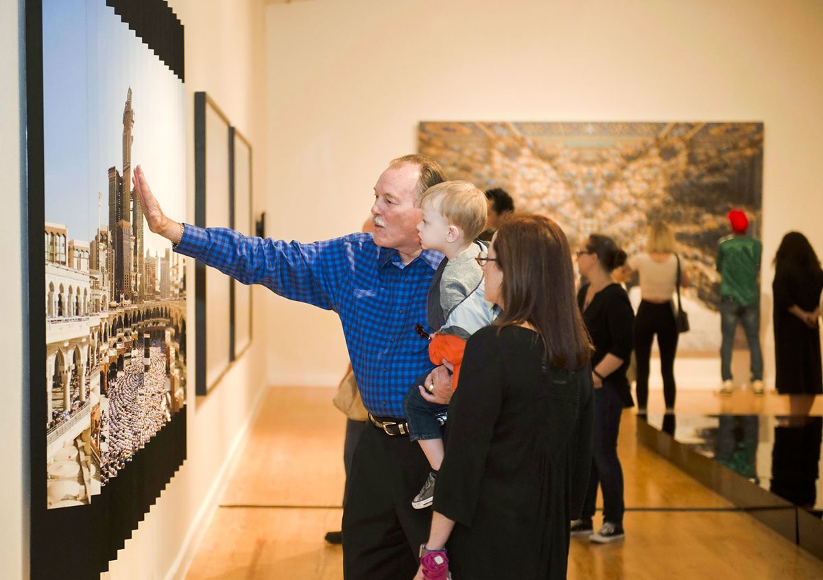 Visitors view Ahmad Angawi&rsquo;s 2013 &ldquo;Wijha 2:148 and everyone has a direction to which he should turn,&rdquo; focusing on the past and present of Makkah&rsquo;s Great Mosque, at the &ldquo;Parallel Kingdom&rdquo; exhibit in Houston&rsquo;s Station Museum.