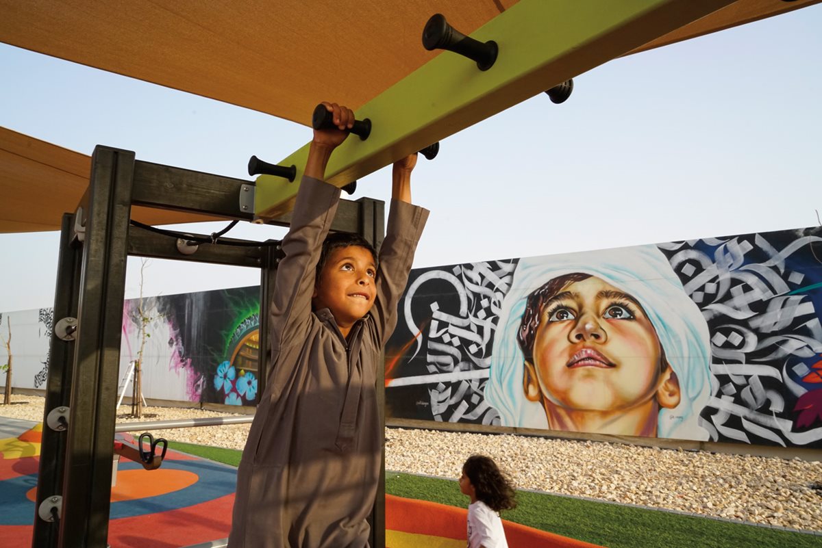 <p><i>Above:</i>&nbsp;Masdar&rsquo;s first park includes not only play equipment but also an audience-powered outdoor cinema: About a dozen of its viewing seats are also stationary bicycles. Messages to Masdar, <i>below right,</i> cover a wall panel following public programs during January&rsquo;s Abu Dhabi Sustain-ability Week.&nbsp;</p>
