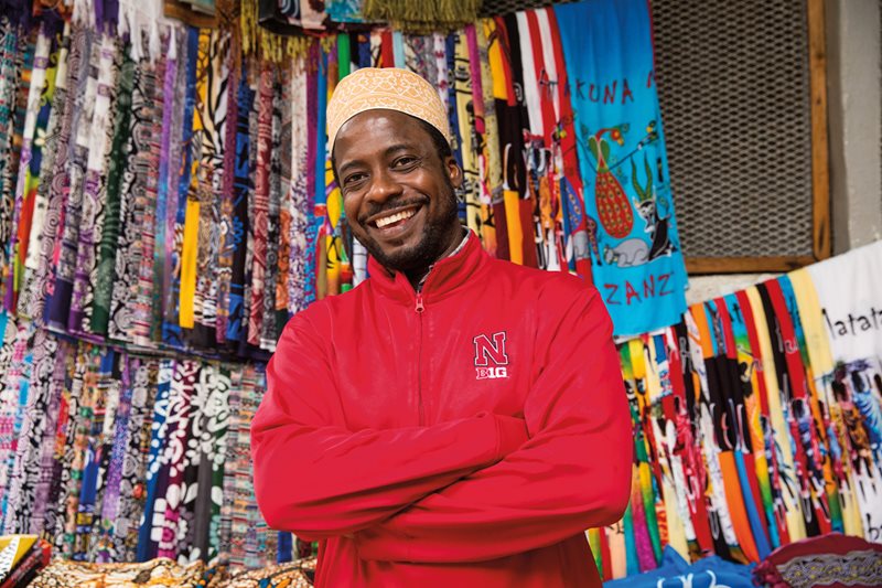 Kanga vendor Mohammed Abdallah Moody works in Stone Town&rsquo;s textile market. He&rsquo;s been in the trade for years and he says the younger traders look to him for expertise. His stall is smaller than many others, but over the years he has befriended many &ldquo;regulars&rdquo;&mdash;including men who buy kanga for their wives and daughters.