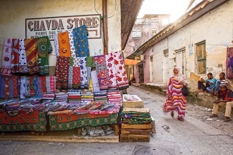 Zanzibar&rsquo;s largest and oldest kanga dealership is Chavda, which also supplies wholesale kanga to other kanga retailers&mdash;possibly including this kanga stand just outside its doors.