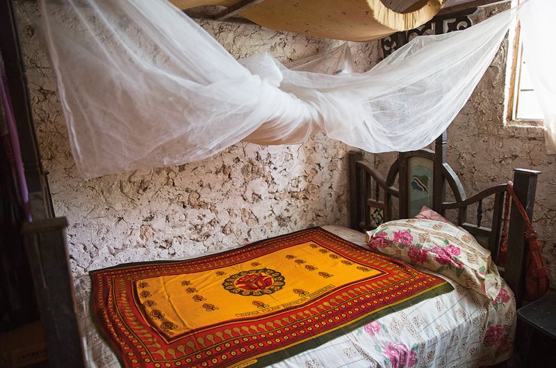 While some kanga are designed to make a statement, others, like this one in the home of Hidaya, a Bwejuu teacher, are used decoratively, adding color and warmth to the room.