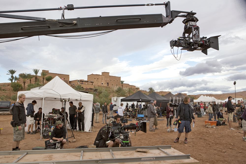 <p>A boom-mounted camera stretches over film-crew members, actors, cameras, tents and gear at <span class="smallcaps">CLA</span> Studios during the filming of episodes in the hbo series <i>Game of&nbsp; Thrones</i>, one of about 100 international television episodes and 20 feature films that annually come to the area.&nbsp;</p>
