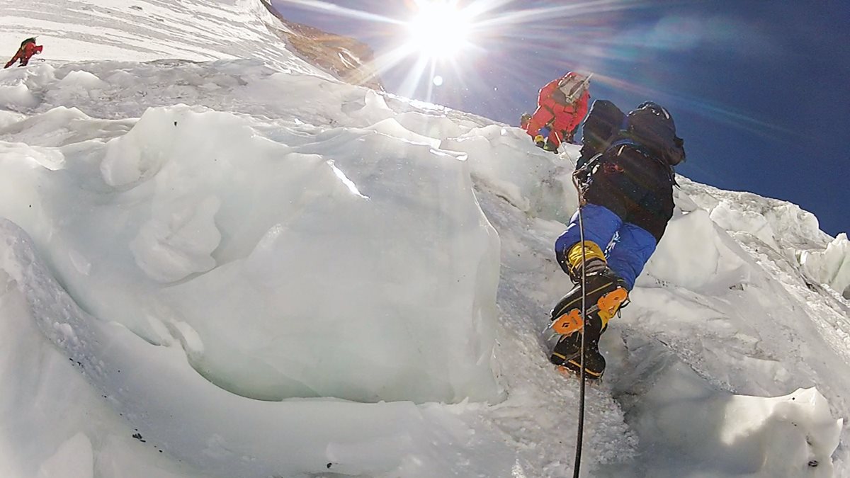 Crampons clamped to her boots help Moharrak and her teammates maintain footing on the route up Mount Everest. Moharrak became one of some 60 women who have reached the summit and, at age 28, one of the youngest.