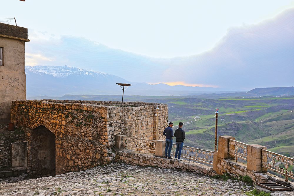 Two young men look over the scenic Sopna valley from a vantage point just inside the Mosul Gate.