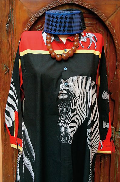 Hassan Hajjaj Dress with zebra motif, amber beads and fez, Riad Yima, Marrakesh. 