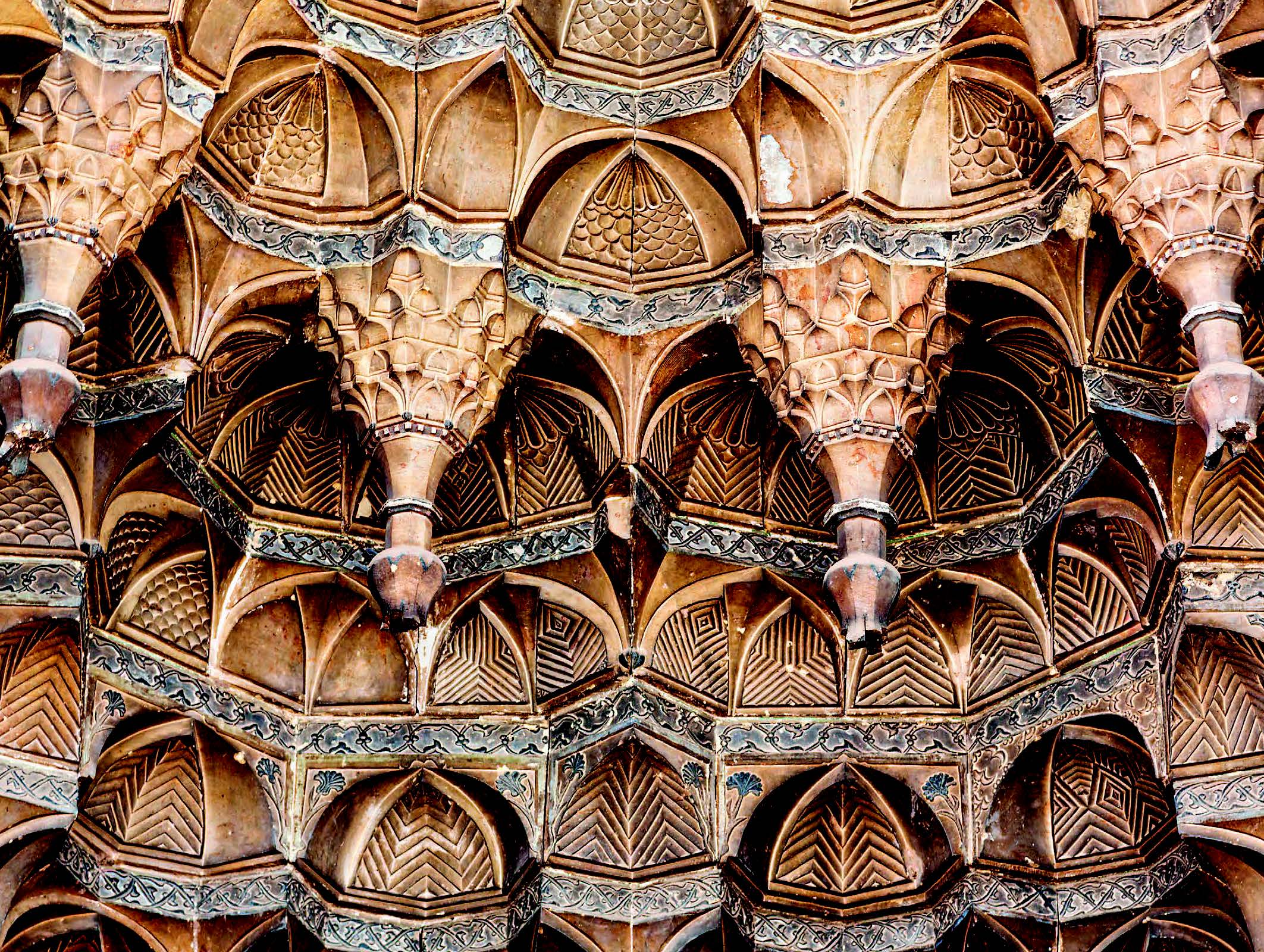 DIYARBAKIR, TURKEY: BAHRAM PASHA MOSQUE Commissioned by Ottoman provincial governor Bahram Pasha, this mosque was completed in 1572–73 according to designs by Sinan, the chief architect to the Ottoman sultans renowned for his mosques in Istanbul and Edirne. The hanging stone pendants over the elaborate portal, themselves decorated with miniature muqarnas, appear to defy gravity.