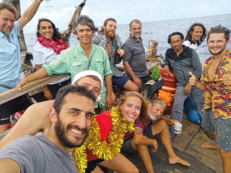 Representing seven nations from Indonesia to Norway, the boat’s transatlantic crew struck a midocean pose. To keep Phoenicia on course day and night, the crew worked and slept in shifts.