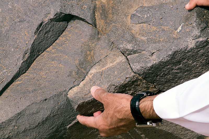 Alkadi shows how a broken fragment of milestone 35 fits in its original position. This year he has found eight more milestones, which bring the known total to 63. More can yet be found, he believes, although many of the undiscovered stones may prove to be permanently lost either through removal or destruction beyond recognition by natural and human interventions. Some may simply lie fully buried; still others may be in fragments as yet too small to have been recognized. 