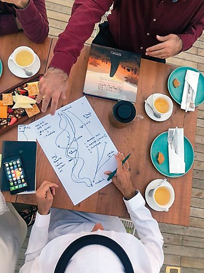 Alkadi maps out further research following publication this year of Milestones of Arabia, which appears on the table next to his map.