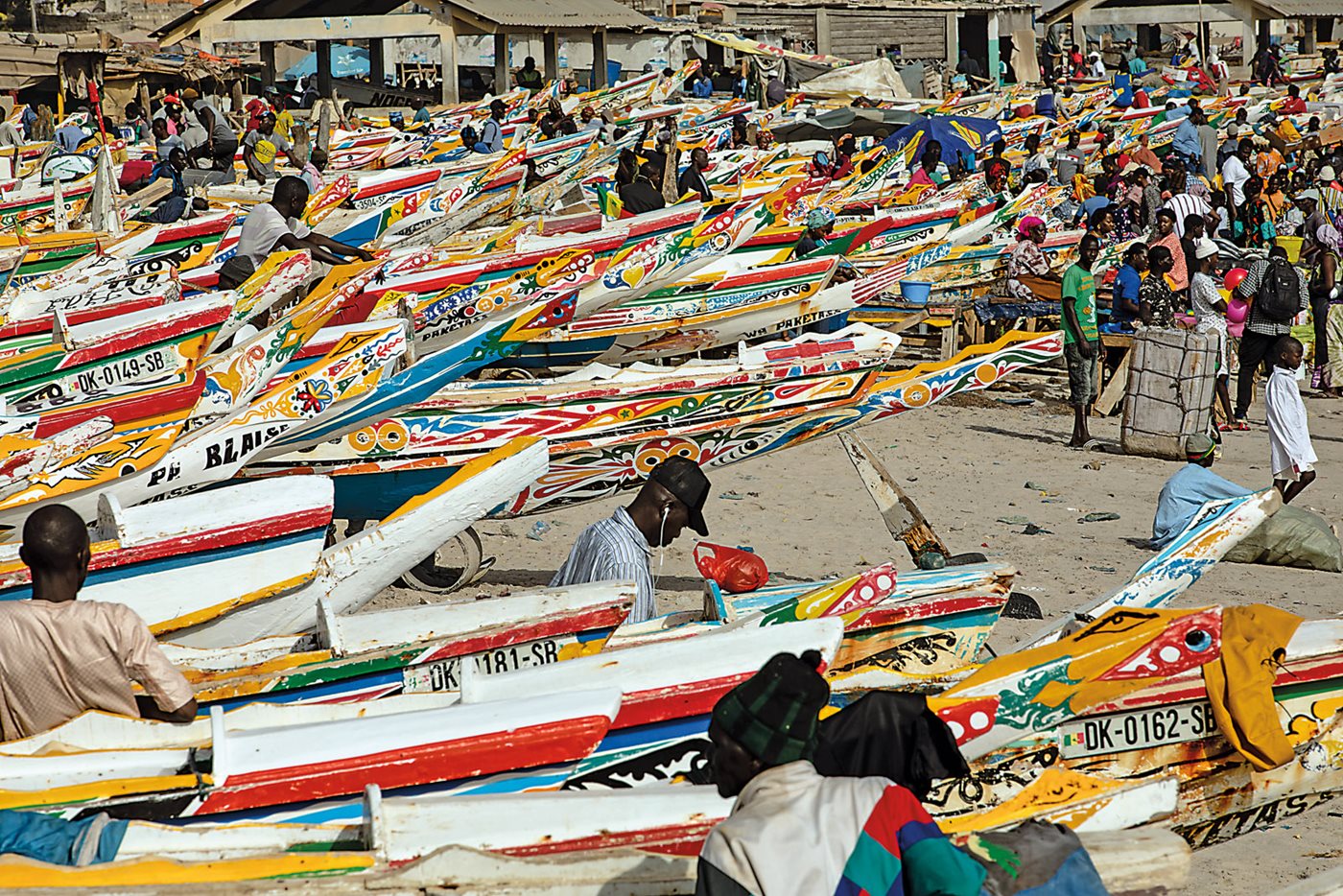 Fishing crews typically set out early in the morning, but the beaches remain active all day, with pirogues coming and going, unloading, and afterward cleaning, gutting and cooking fish, all amid the sounds of waves and vendors. 