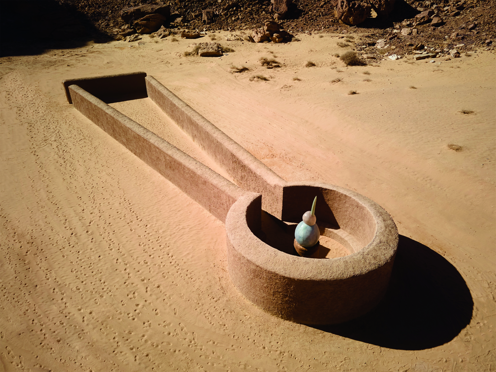 Saudi artist Sultan bin Fahad looked to the region’s distant past in his construction of an abstract, sculptural kite, so called by archeologists who have discovered remains of hundreds of such constructions throughout the northwestern Arabian Peninsula and beyond. Dating from Neolithic and even earlier periods, kites are believed to have been hunting traps: Sometimes more than 100 meters on a side, they helped hunters drive game into and down the top “wedge” and, once their prey entered the circular corral, the hunters could use spears.