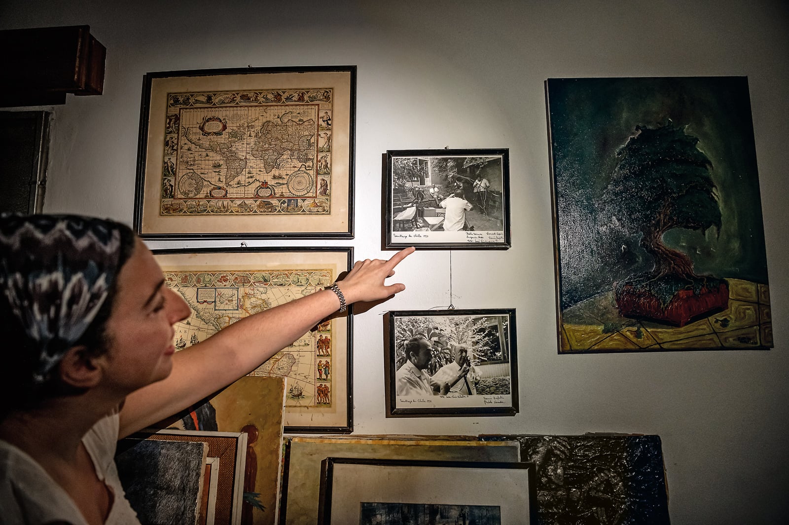 Samia Kafati points out a photo of her father filming a documentary with prized Chilean poet Pablo Neruda in Santiago, Chile. 