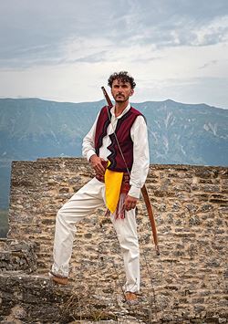 Ilir Loku, 40, wears a traditional costume and carries a broadsword