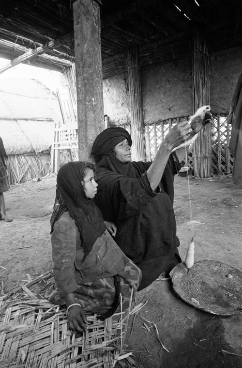 Spinning wool by hand was one of the many skills taught by one generation to the next.