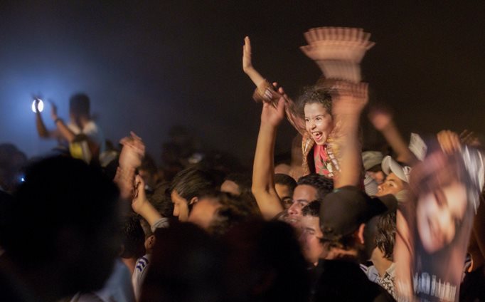 A young girl enjoys the concert. 