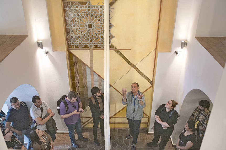 Fernando Grácio Martins, center right, gives a tour at the Núcleo de Arte Islâmica to a group of students from a Spanish university.