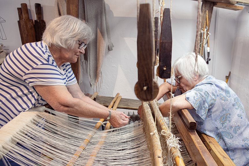 Helena Rosa, right, works on a loom as Fatima Mestre assists her at a weaving workshop in Mértola. Every step in making woven textiles uses centuries-old techniques.