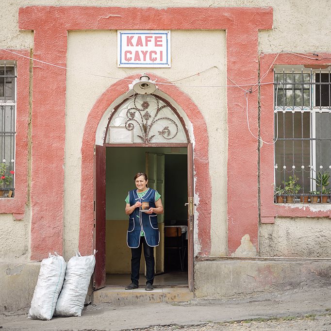 At Kafe Cayci in Dashkasan, a woman holds a pot of traditionally stewed piti. The name comes from the earthenware pot in which it’s cooked and served.