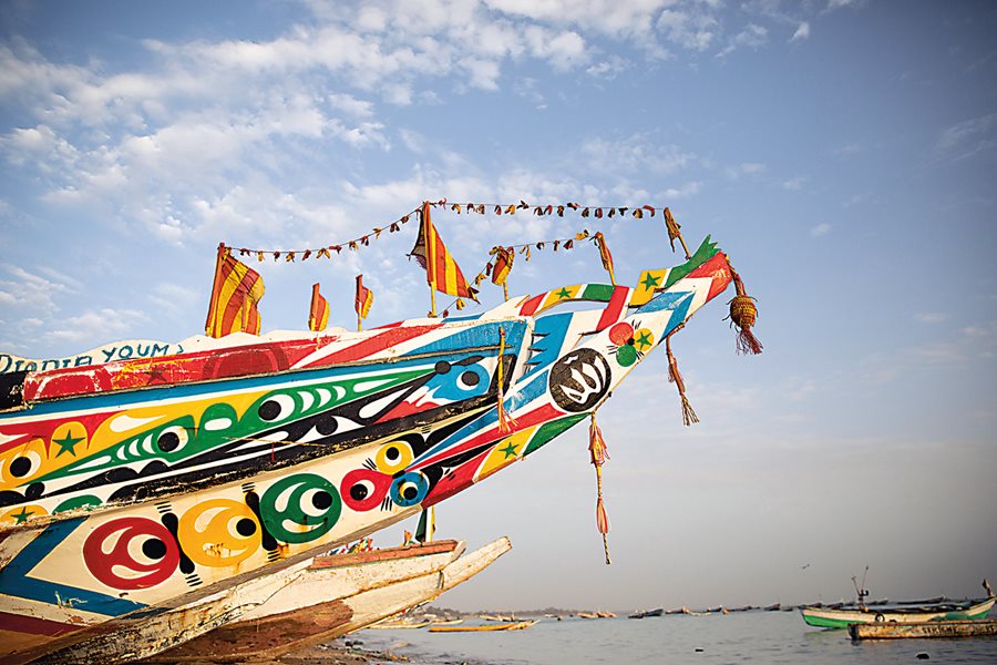 Pirogues line the beach also in Mbour, 80 kilometers south of Dakar, which has become one of the most important fish-handling centers in the region.